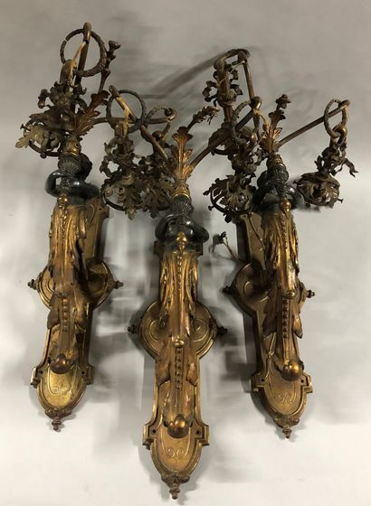 null Three sconces in bronze and chased gilt bronze decorated with two-light terms

Six...