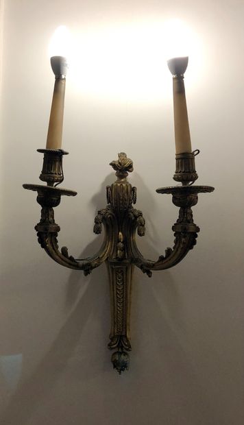 null Pair of sconces with two arms of light in chased and gilded bronze decorated...