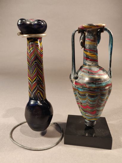 null Bottle and amphorisk in glass paste, one of which is shaped like a phallus....