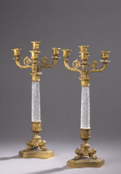 null Pair of gilt bronze and chased candelabras, cut crystal shaft, five lights....