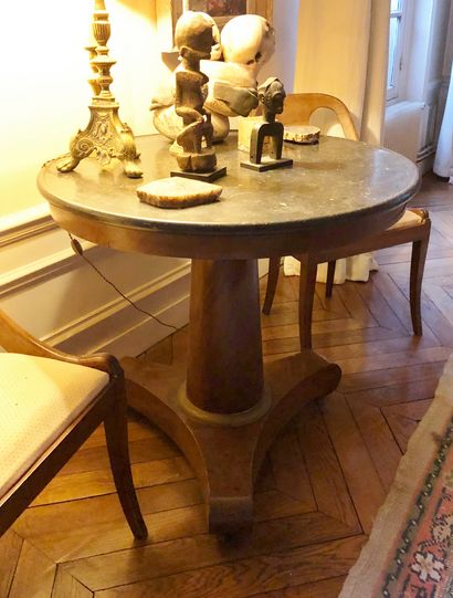 null Mahogany and mahogany veneer tripod pedestal table on casters. Grey marble top....