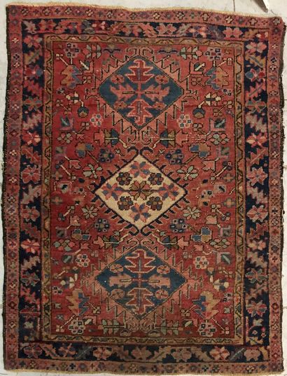 null Persian carpet with three central lozenges, red background, geometric decoration,...