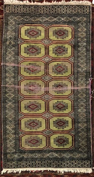 null Bukhara carpet decorated with guhls on a wine-red background, ten borders.

Wear...