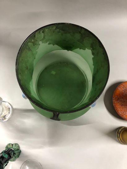 null Lot including:

- A large green tinted glass vase with metal frame with floral...