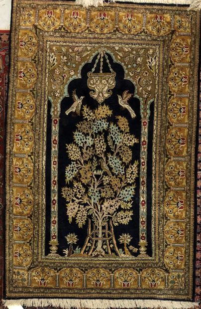 Persian silk carpet decorated with a mosque...