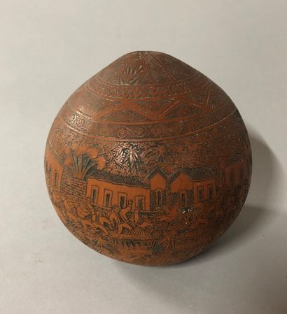 null Coconut engraved with decoration of a village party in South America between...