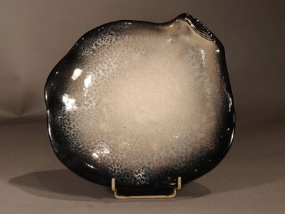 null POL CHAMBOST (1906-1983)

Suite of ten plates "Oysters", 1957-1958

Black glaze...