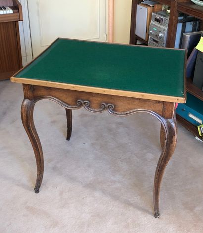null Game table in molded and carved walnut opening with two drawers in the belt,...