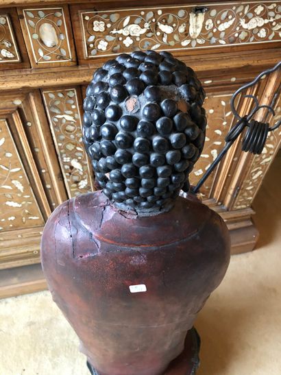 null Painted wood and red lacquer Buddha on a base decorated with a lotus flower....