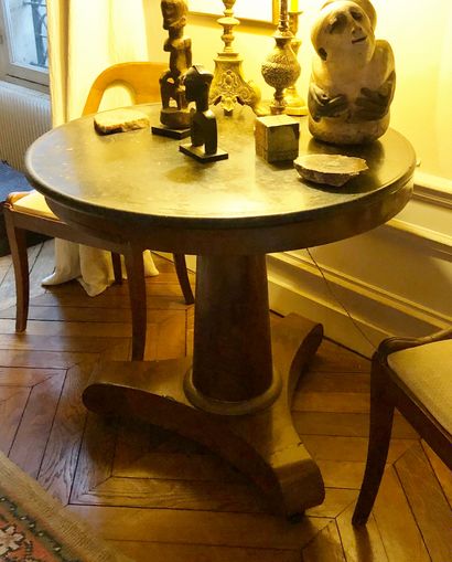 null Mahogany and mahogany veneer tripod pedestal table on casters. Grey marble top....