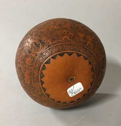 null Coconut engraved with decoration of a village party in South America between...