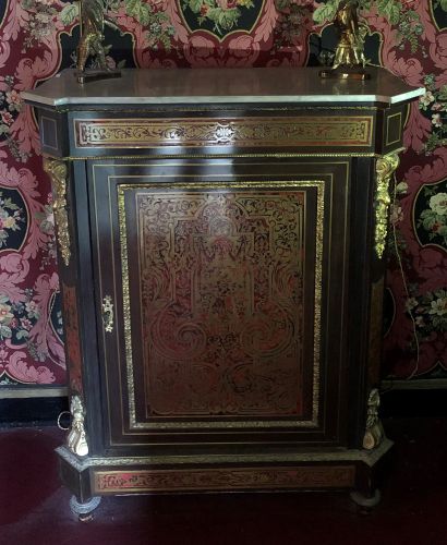 null Piece of furniture of blackened wood and marquetry Boulle, nets of brass and...