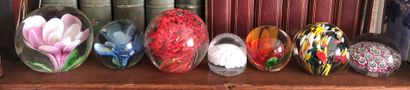 null Set of seven paperweights.