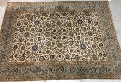 null 
Large Persian carpet with cream background decorated with blue foliage scrolls,...