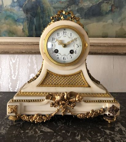 null White marble and gilded bronze mantel set. Clock decorated with ribbon bows,...