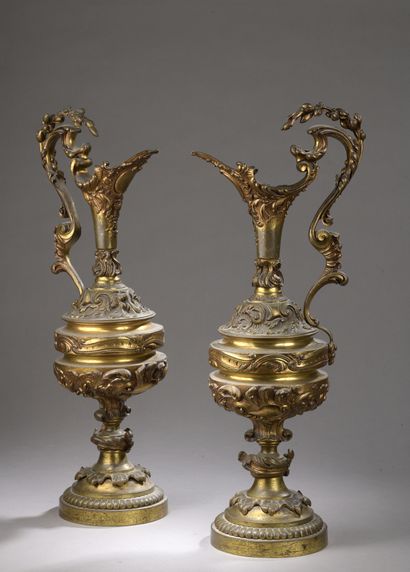 null Pair of large simulated ewers of baluster form, in polished bronze with rocaille...