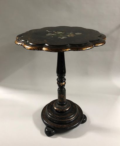 null Pedestal table in blackened wood with a poly-lobed turntable decorated with...