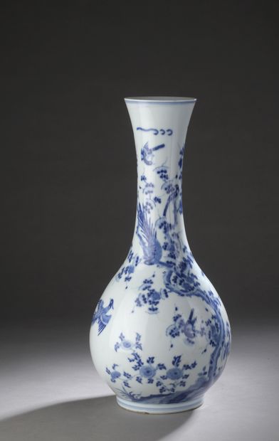 null Porcelain vase of baluster form with wide body and narrow flared neck, decorated...