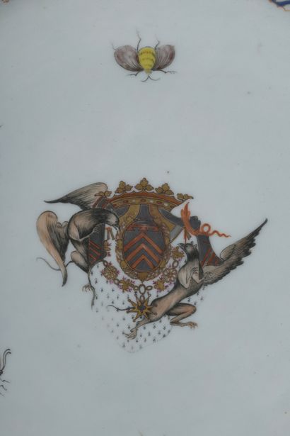 null Porcelain dish with polychrome decoration of coats of arms surrounded by insects...