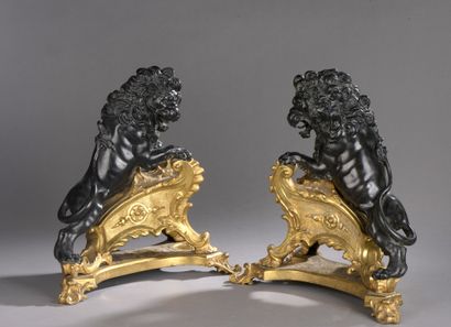 PAIR OF CHENETS in patinated bronze and gilt...