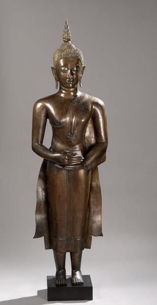 null STATUE in bronze, Buddha standing, hands holding the alms bowl, dressed in the...