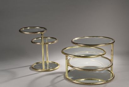 null TWO circular gilt brass CONSOLES with rotating glass tops.

Work of the XXth...