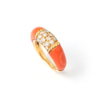 null Ring in 18K yellow gold centered with a diamond-paved motif supported by red...