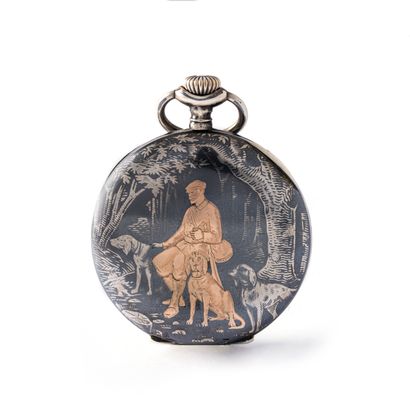 null Silver 800‰ and 18K rose gold pocket watch depicting a hunter and his dogs.

Late...