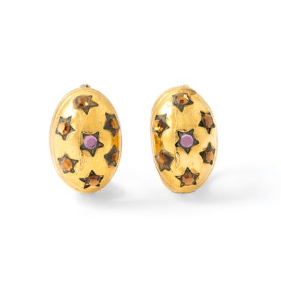null Pair of gold-plated earrings studded with orange and purple stones, in star...