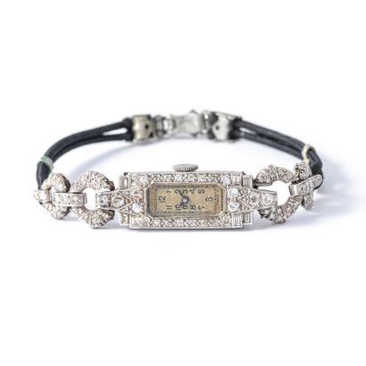 null Bracelet watch in 950‰ platinum set with diamonds.

Black cord. Metal clasp....