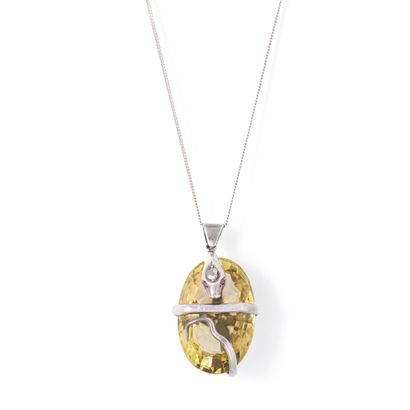 Silver 800‰ pendant holding a quartz representing...