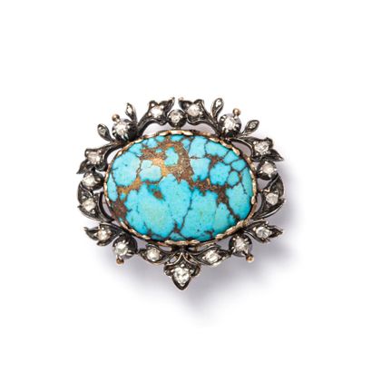 14K gold and 800‰ silver brooch centered...