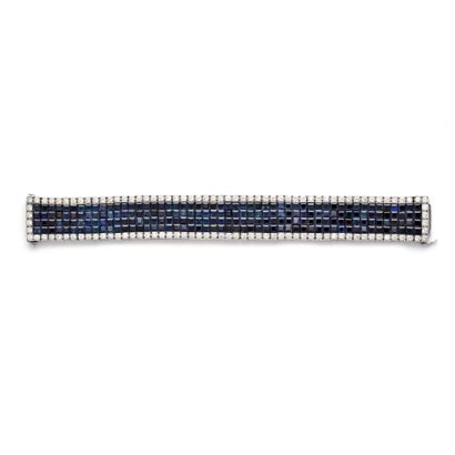 null Articulated 950‰ platinum bracelet, adorned with sapphires in invisible settings...