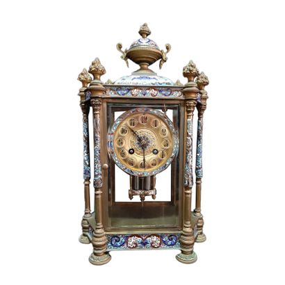 null Mantelpiece including :

A clock and two vases mounted in bronze and cloisonné...