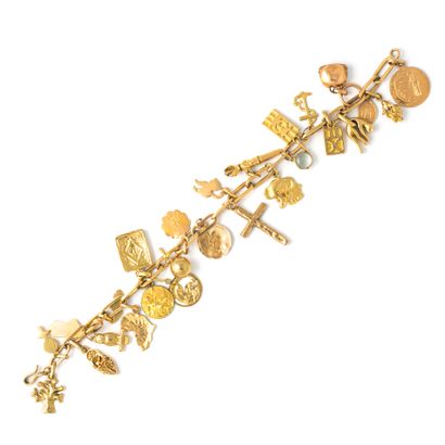 null Bracelet in 9K, 14K and 18K yellow gold holding numerous pendants and charms...