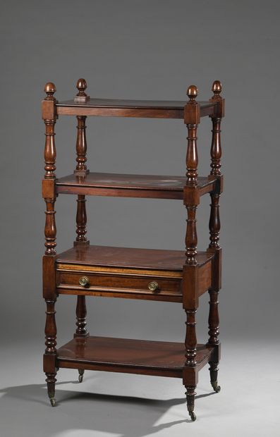 null A mahogany and mahogany veneer four-tiered shelving unit with one drawer, the...
