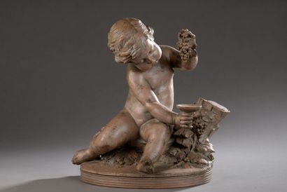 null STATUTE in patinated terra cotta, representing a young Bacchus holding a cup...
