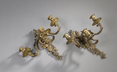 null Pair of gilded bronze sconces with three sinuous foliage arms, decorated with...