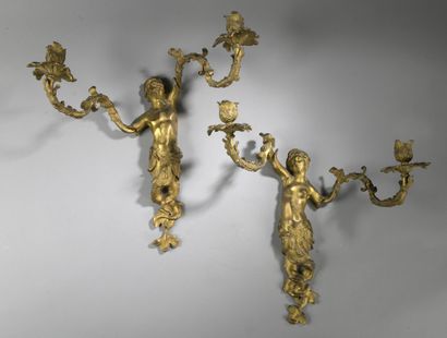 null Pair of large gilt bronze sconces with two foliated arms representing a mermaid...