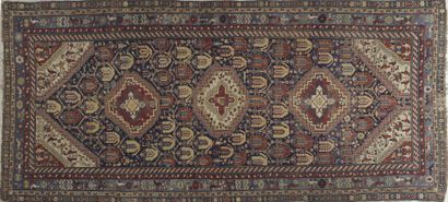 null CHIRVAN RUG decorated with three octagonal medallions on a midnight blue background...