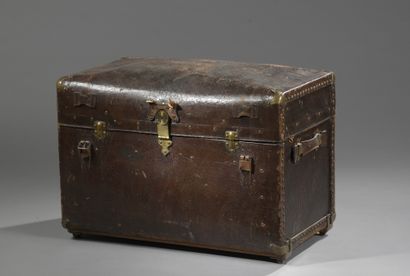 null TRAVELLING CASE with a domed lid covered with leather, the interior with four...