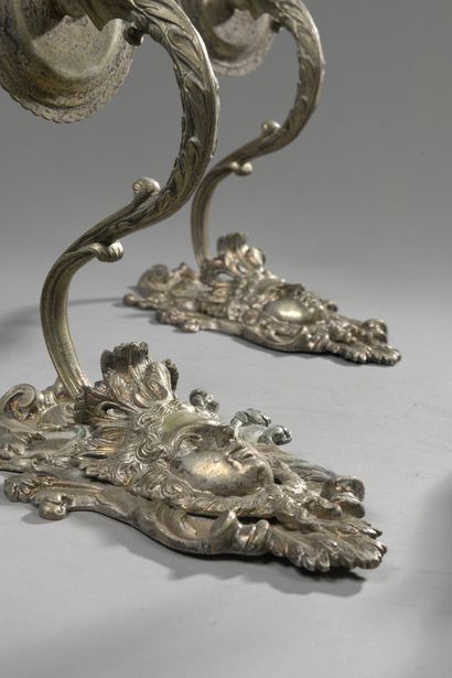 null TWO PAIRS OF APPLIQUES in re-silvered bronze with one arm of light, decorated...