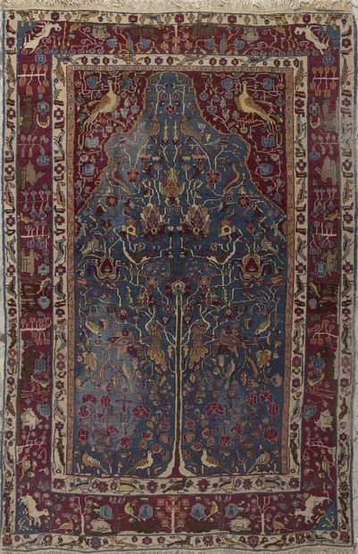 null KIRMAN PRAYER RUG with mihrab decorated with trees of life, flowers and birds....