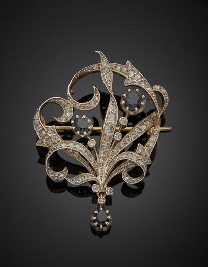 null 18K yellow gold 750‰ and silver 2nd title 800‰ brooch, decorated with scrolls...