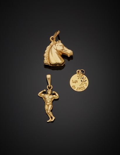 Two 18K yellow gold 750‰ pendants and a medal,...