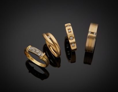null Lot comprising four 18K yellow and two-tone gold 750‰ wedding bands set with...