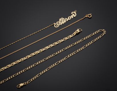 null Lot including:

- 14K yellow gold chain 585‰, Figaro mesh. L. 63 cm.

- Chain...