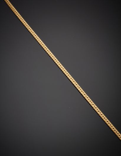 null Panther pendant in 18K yellow gold 750‰, fitted with a large bélière, on a flat-mesh...