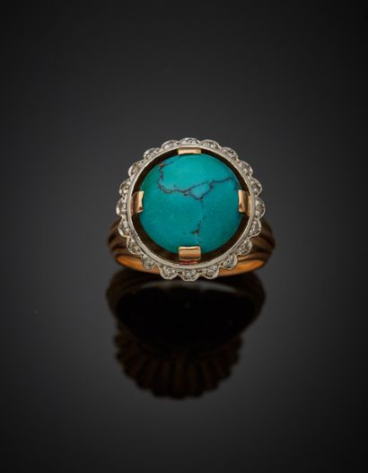 null 18K yellow gold 750 ‰ and platinum 850‰ ring, adorned with a turquoise cabochon...