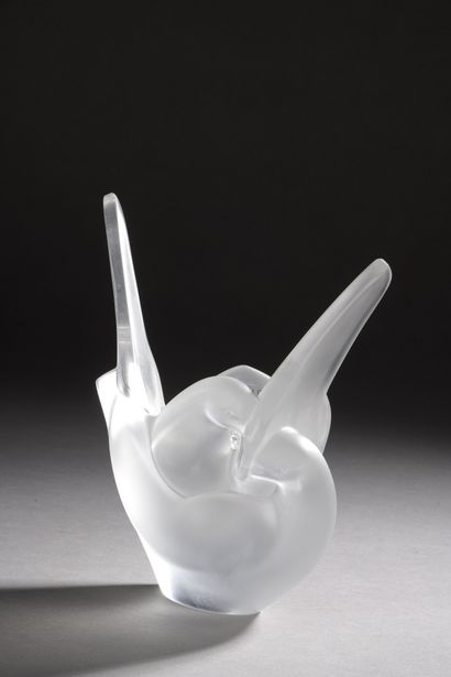 null LALIQUE

Vase pique-fleurs out of moulded-pressed glass representing two embraced...